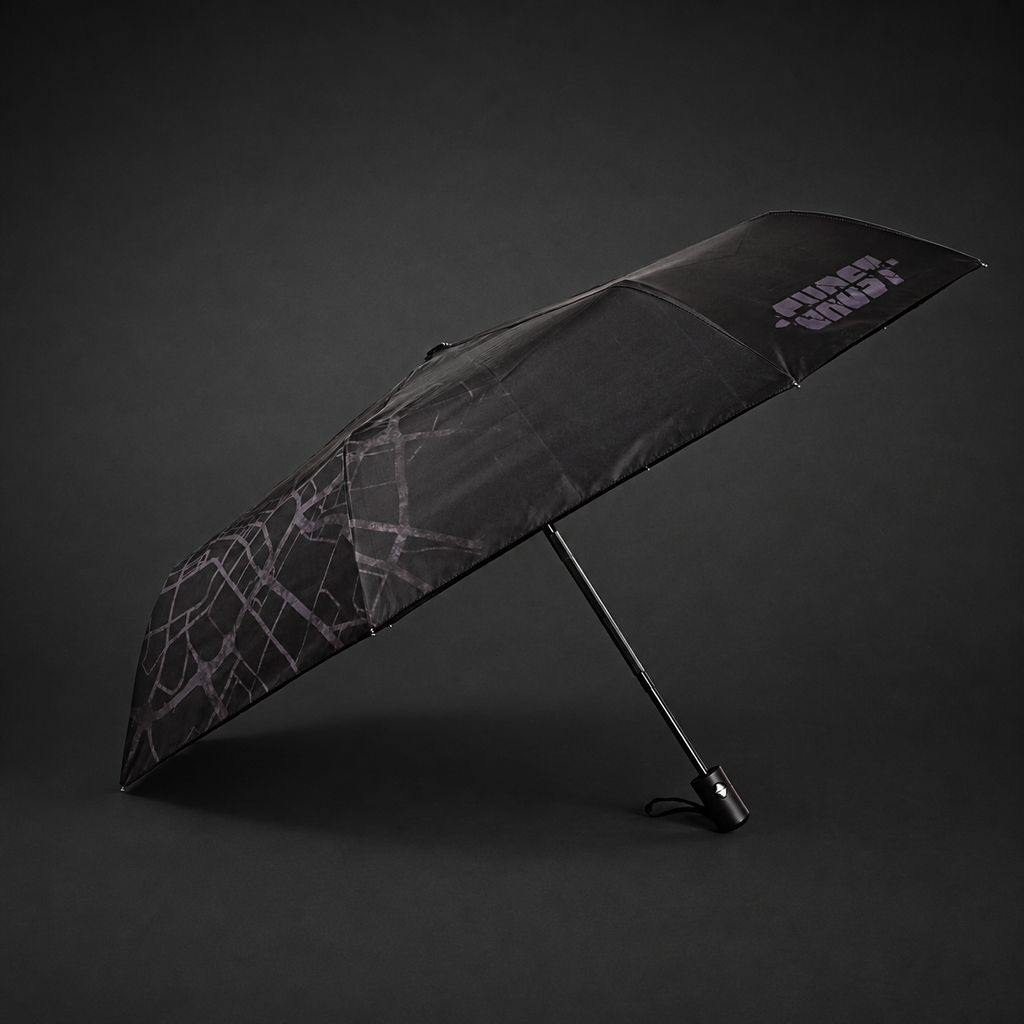 Side view of the open automatic folding umbrella showing its black outer canopy and map pattern