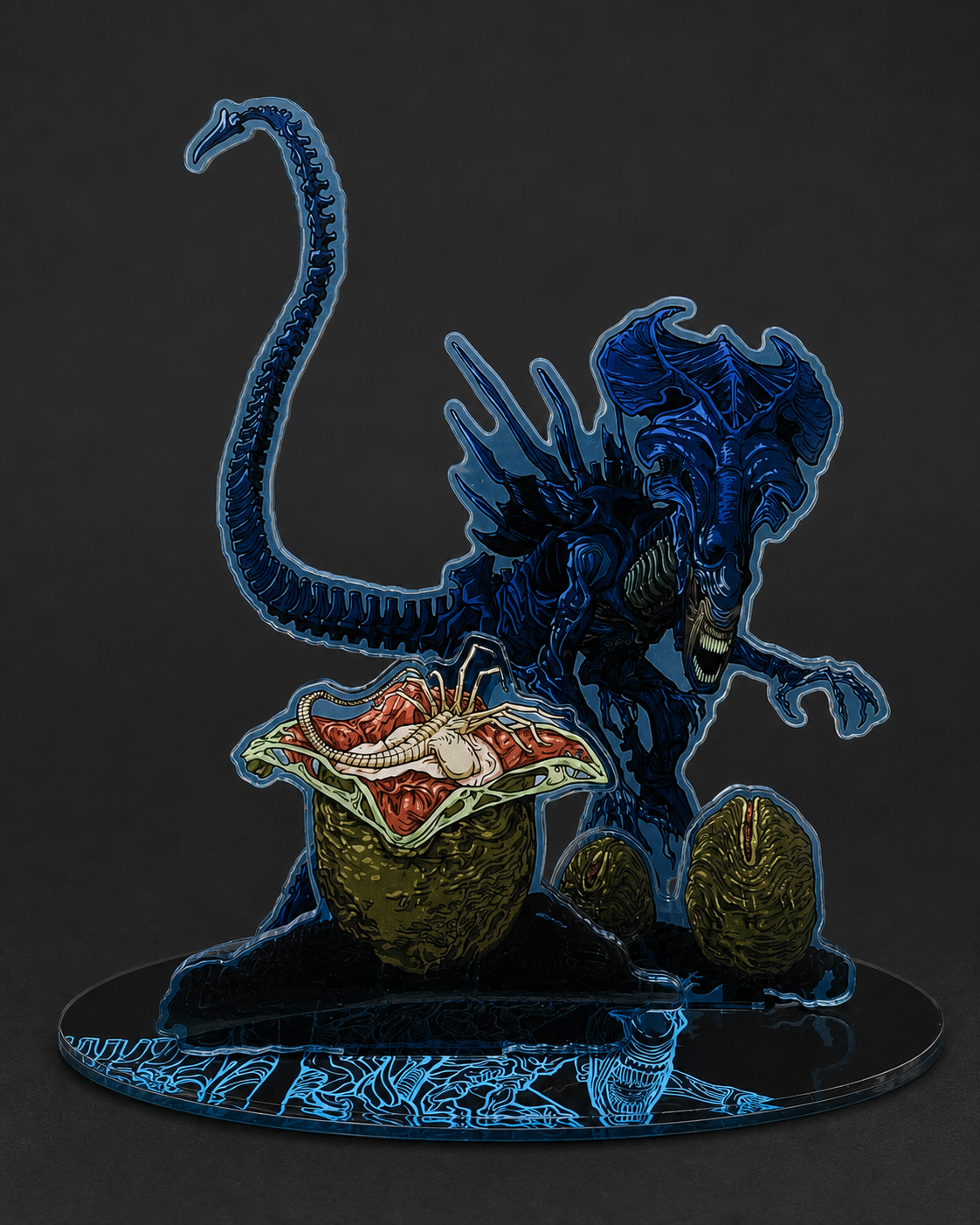 Xenomorph Queen-inspired three-insert acrylic display stand featuring the Queen, two eggs, and an open egg with a small Facehugger